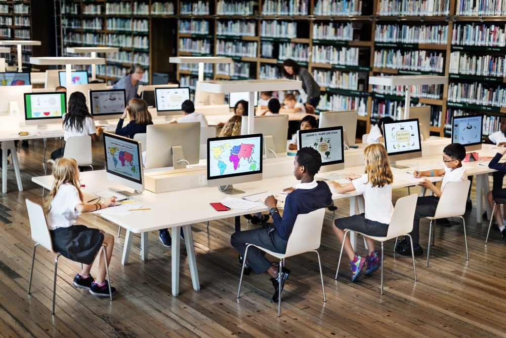 kids on computers in school library