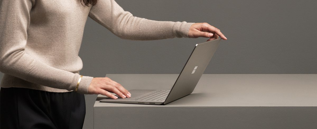 woman using a microsoft laptop
