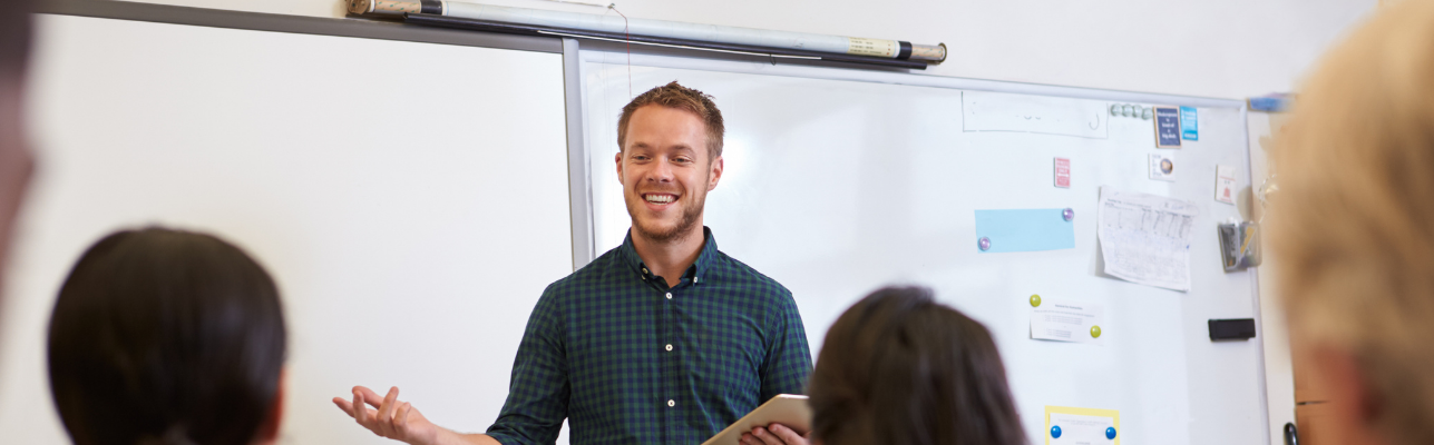 man presenting in a classroom